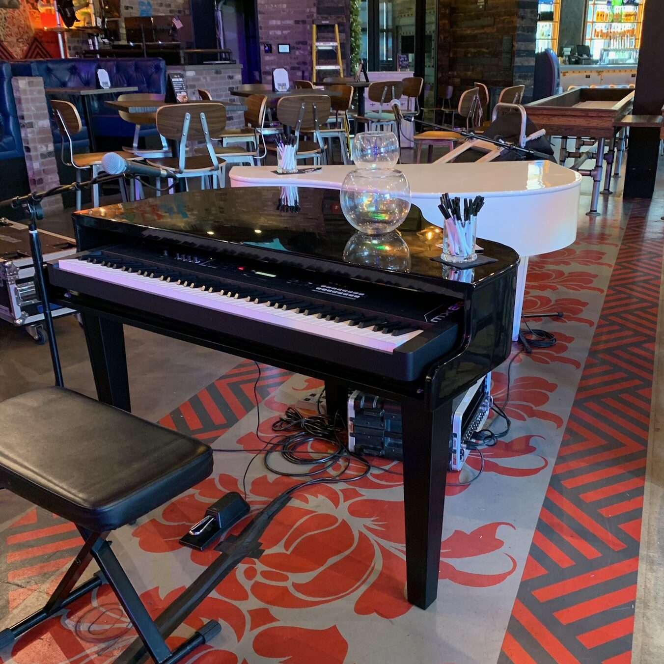 Black piano shell rental with keyboard and bench