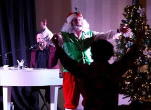 Corporate holiday party dueling pianos with Santa