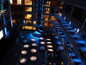 gala event set up with tables, stage, and low lighting